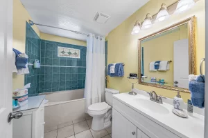 English Garden Bathroom with vanity and bathtub - Windemere Inn Florida bed and breakfast