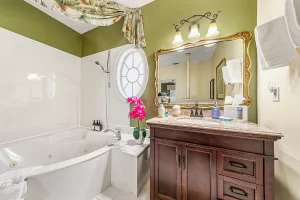 Melbourne Bedroom with a vanity and jetted bathtub - Windemere Inn Florida bed and breakfast