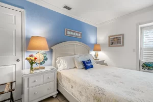 South Beach Bedroom blue and white suite with window - Windemere Inn Florida bed and breakfast