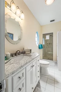 Summer Garden Bathroom granite marbled vanity and standing shower - Windemere Inn Florida bed and breakfast