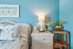 Summer Garden Bedroom blue and white suite with wicker nightstand - Windemere Inn Florida bed and breakfast