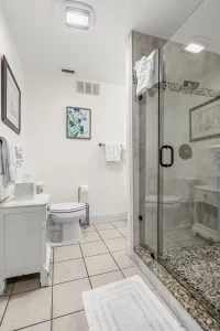 Wavecrest Bathroom vanity and tile shower - Windemere Inn Florida bed and breakfast