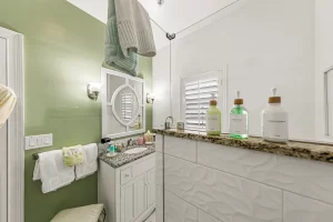 Forever Spring Bathroom glass walled walk-in shower and vanity - Windemere Inn Florida bed and breakfast