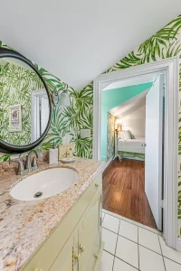 Lookout Bathroom with granite vanity and looking into bedroom - Windemere Inn Florida bed and breakfast