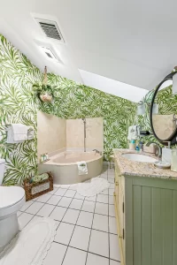 Lookout Bathroom with jetted bathtub, vanity, and sunroof - Windemere Inn Florida bed and breakfast