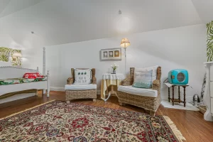 Lookout Sitting Area with wicker chairs and mini fridge - Windemere Inn Florida bed and breakfast