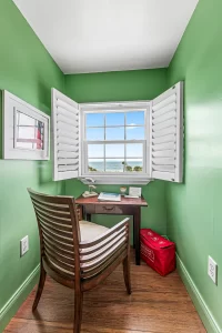 Lookout Work Station green and white suite desk and window with an ocean view - Windemere Inn Florida bed and breakfast