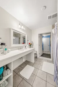 South Beach Bathroom large white granite vanity - Windemere Inn Florida bed and breakfast