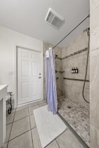 South Beach Bathroom large walk-in tiled shower - Windemere Inn Florida bed and breakfast