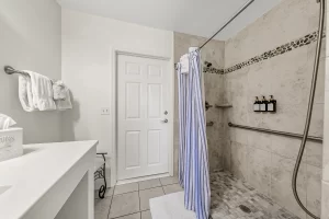 South Beach Bathroom tiled standing shower - Windemere Inn Florida bed and breakfast