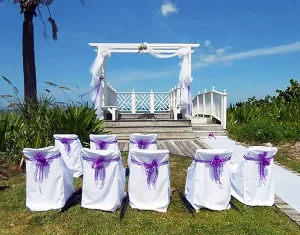 Windemere Inn Florida Beachfront Wedding - outdoor pergola and chairs decorated with flowers, lace, and ribbons