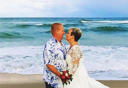 Windemere Inn near Melbourne, FL -romantic beachfront weddings couple kissing in front of ocean after ceremony