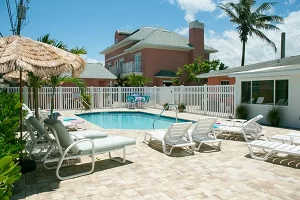 Windemere Inn by the Sea - best bed and breakfast in Florida - view of pool with main house in background, beachfront B&B near melbourne fl