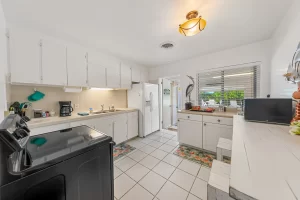 805 Beachside - Kitchen with view to Dining Room and outside