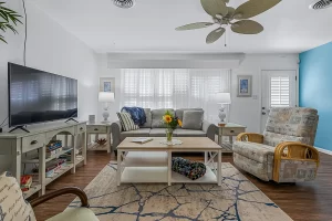 805 Beachside Suite - Living Room area with windows and ceiling fan