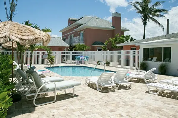 Windemere Inn by the Sea - best bed and breakfast in Florida - view of pool with main house in background, beachfront B&B near melbourne fl
