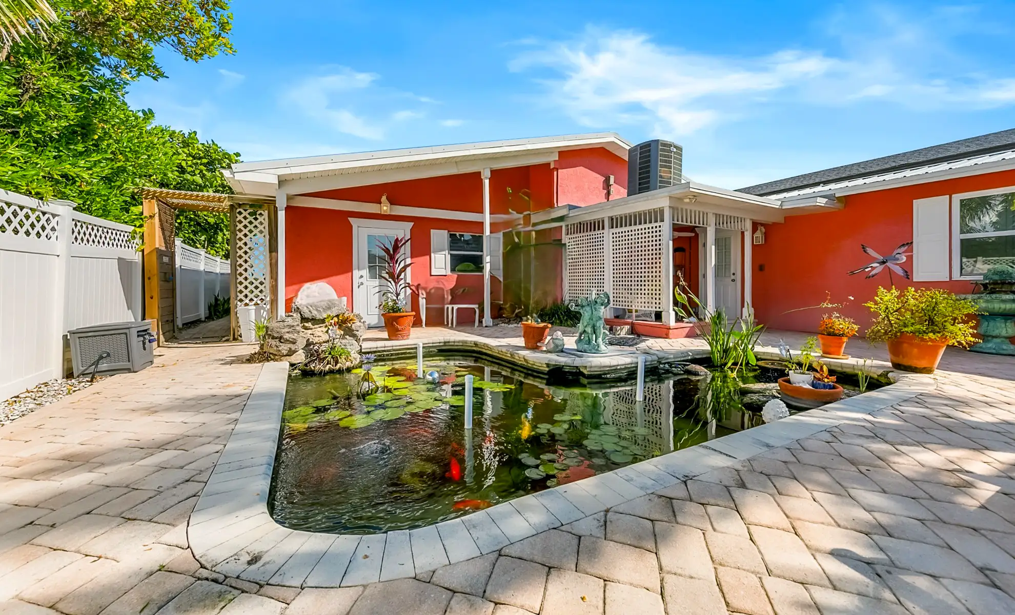 Windemere Inn example of amenities - private patio with Koi pond